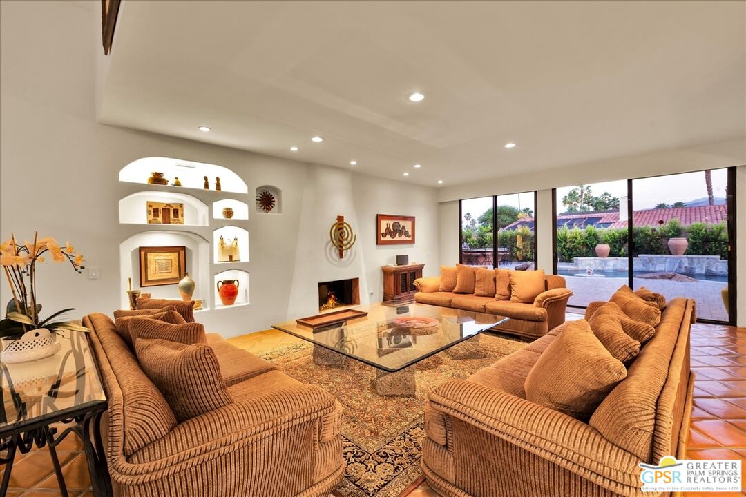 71121 Sunny Lane Rancho Mirage, CA 92270 - Photo 66 of 75 a living room with fireplace furniture and a large window