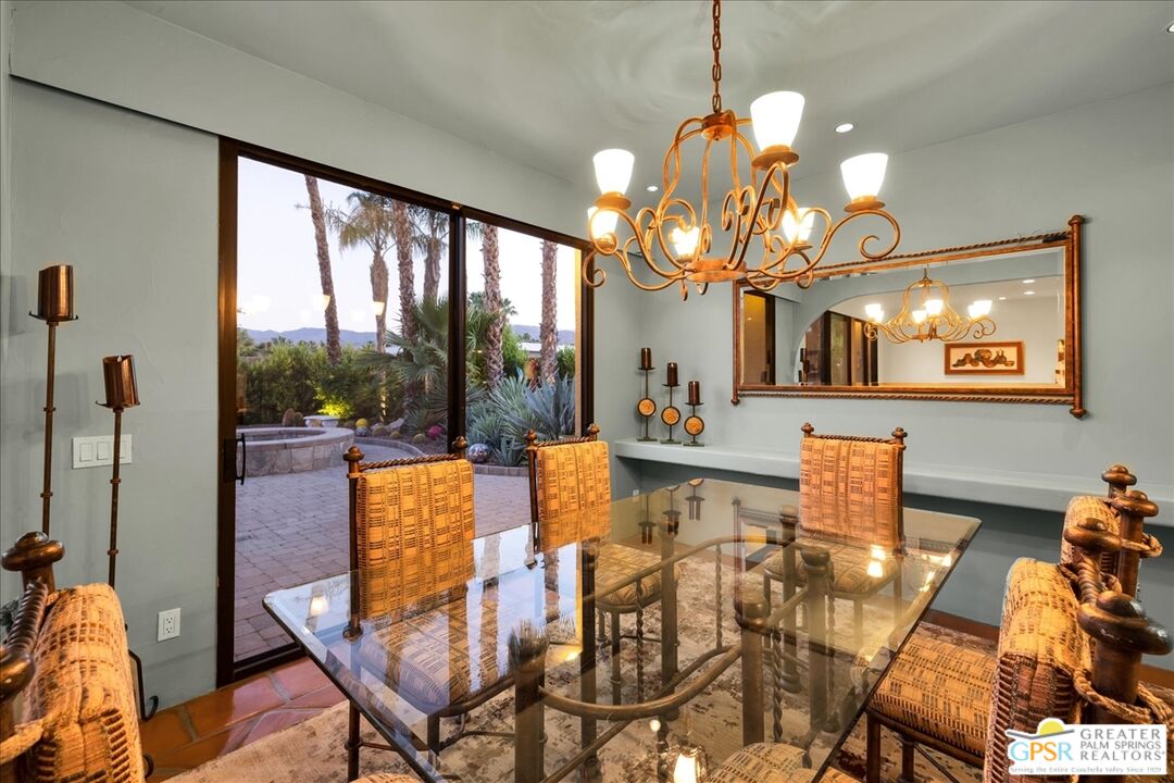 71121 Sunny Lane Rancho Mirage, CA 92270 - Photo 68 of 75 a view of a dining room with furniture wooden floor and chandelier