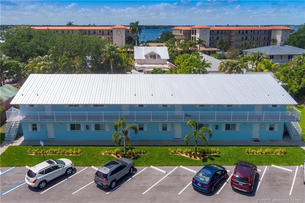 644 Southwest Cleveland Avenue, Unit 6 Stuart, FL 34994 - Photo 12 of 22 a view of a backyard with plants and a patio