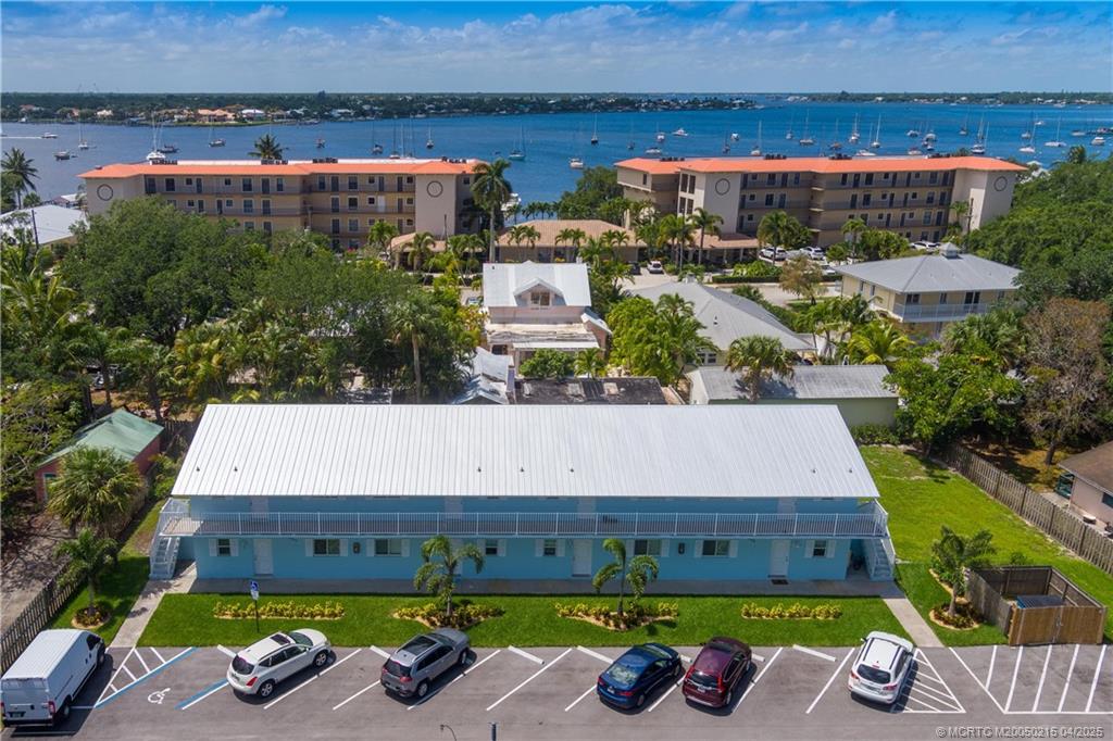 644 Southwest Cleveland Avenue, Unit 6 Stuart, FL 34994 - Photo 14 of 22 a view of a swimming pool with potted plants