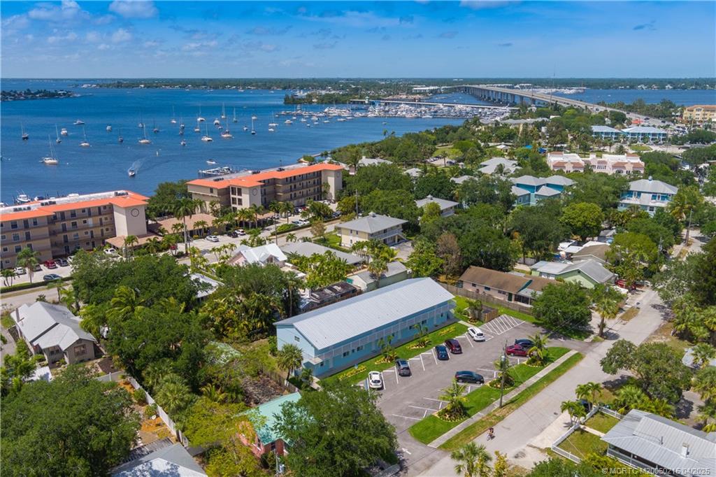 644 Southwest Cleveland Avenue, Unit 6 Stuart, FL 34994 - Photo 15 of 22 an aerial view of a city with lots of residential buildings ocean and mountain view in back