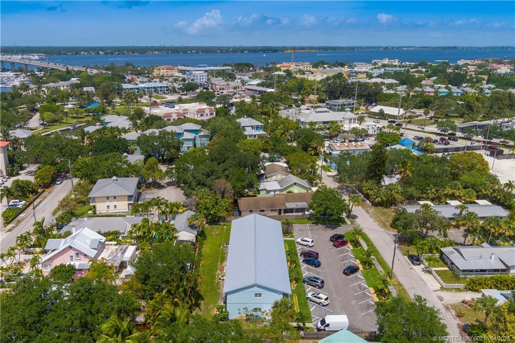 644 Southwest Cleveland Avenue, Unit 6 Stuart, FL 34994 - Photo 16 of 22 an aerial view of residential building and lake