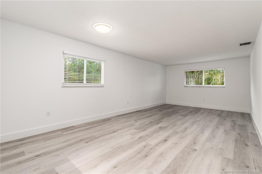644 Southwest Cleveland Avenue, Unit 6 Stuart, FL 34994 - Photo 2 of 22 an empty room with a window
