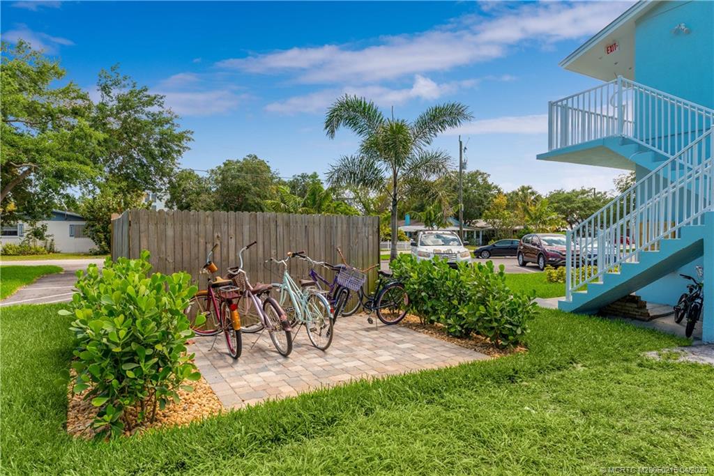 644 Southwest Cleveland Avenue, Unit 6 Stuart, FL 34994 - Photo 22 of 22 a view of a chair and table in backyard of the house
