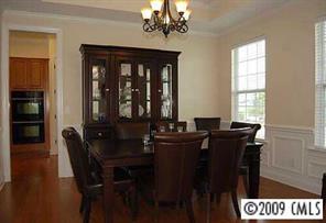 926 Treasure Court Fort Mill, SC 29708 - Photo 3 of 8 a view of a dining room with furniture window and wooden floor