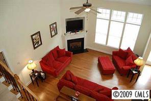 926 Treasure Court Fort Mill, SC 29708 - Photo 4 of 8 a living room with furniture and a flat screen tv