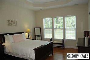 926 Treasure Court Fort Mill, SC 29708 - Photo 6 of 8 a bedroom with a bed and a large window