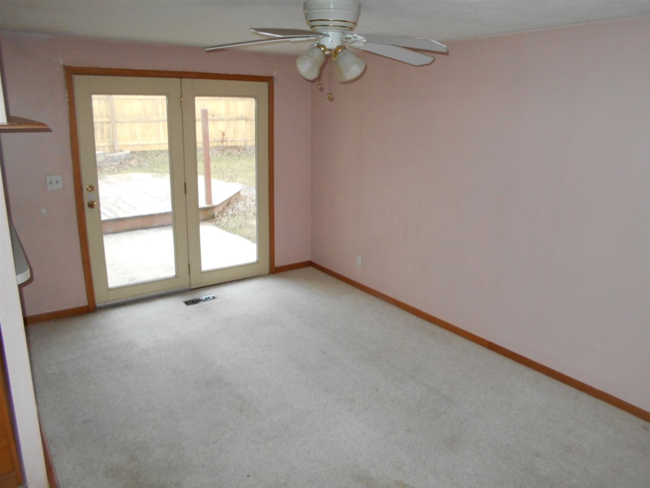 1017 Kenmore Road Rockford, IL 61108 - Photo 5 of 9 an empty room with windows