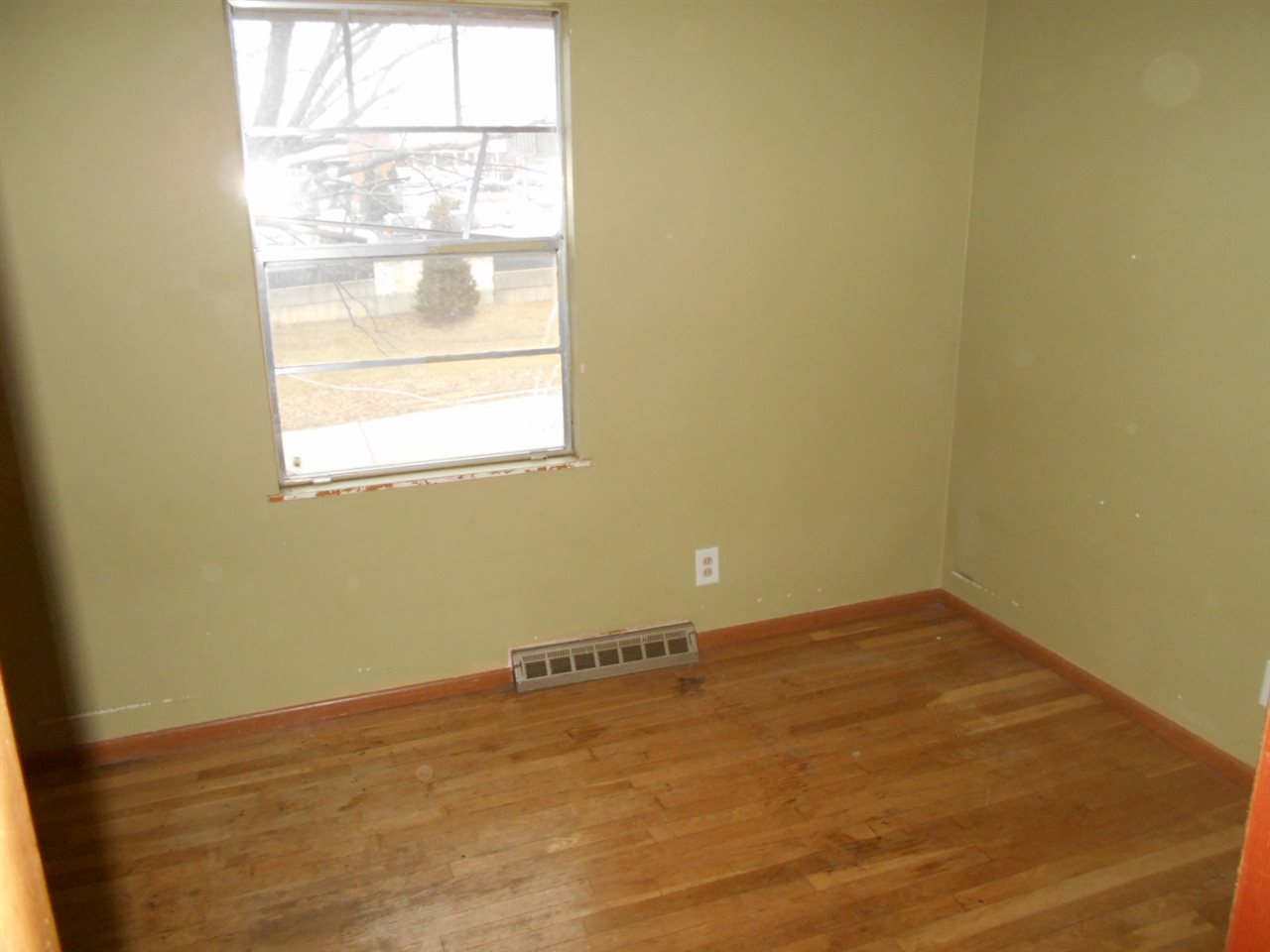 1017 Kenmore Road Rockford, IL 61108 - Photo 8 of 9 a view of an empty room with a window