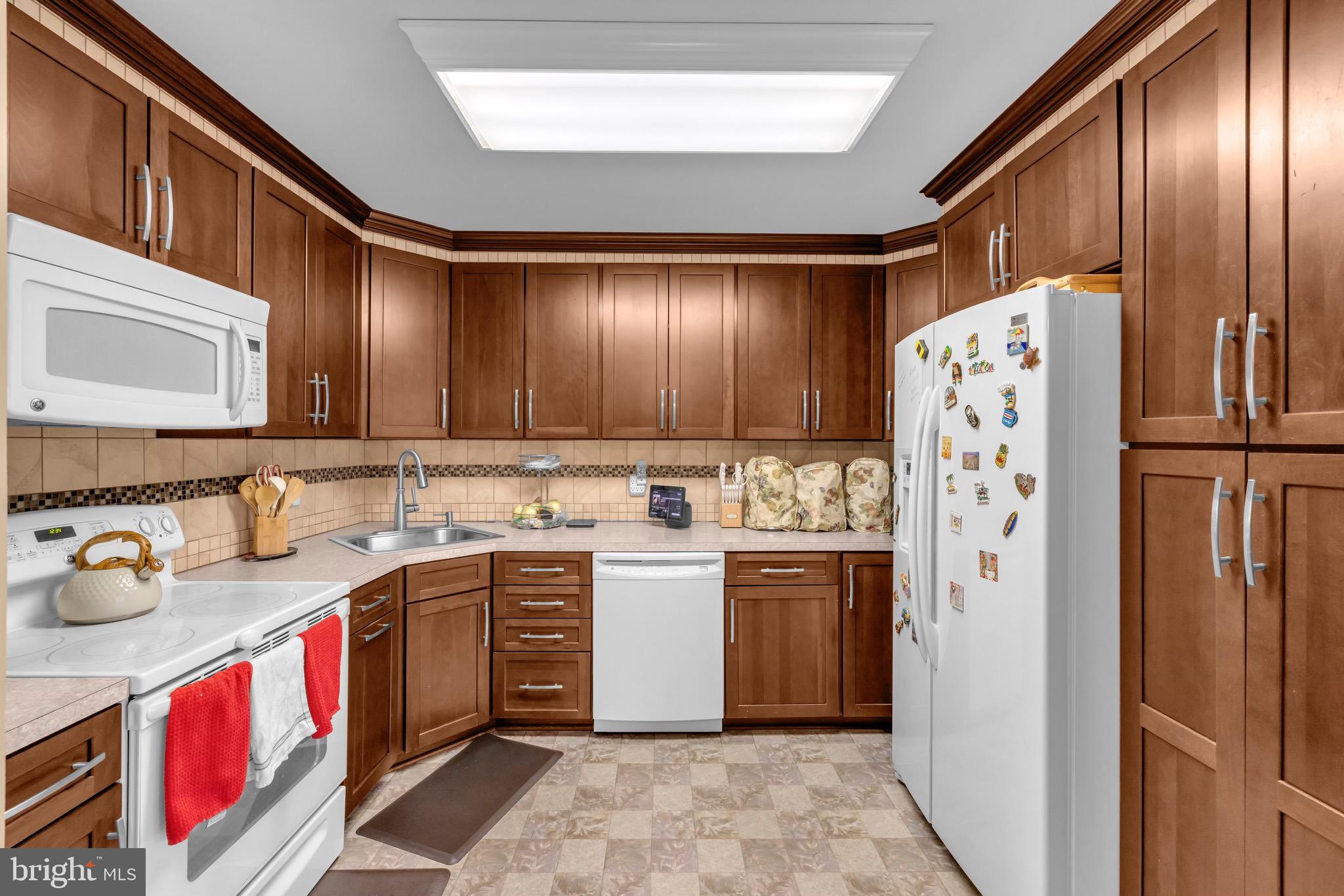 1902 Juniper Road Edgewood, MD 21040 - Photo 11 of 36 a kitchen with stainless steel appliances granite countertop a refrigerator and a stove top oven