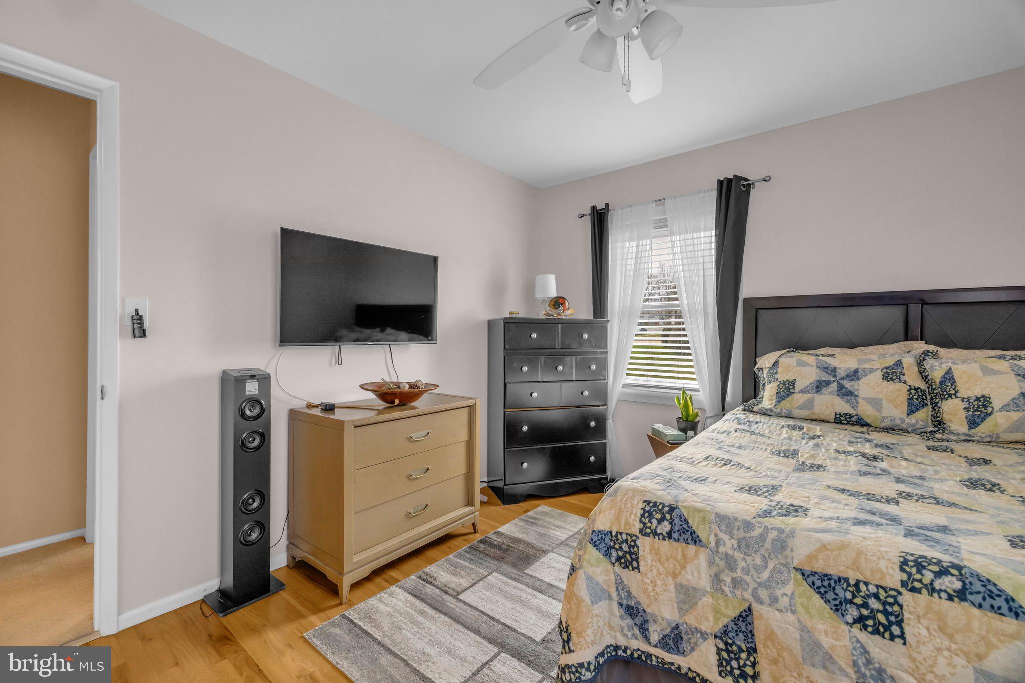 1902 Juniper Road Edgewood, MD 21040 - Photo 17 of 36 a bedroom with a bed and a flat tv screen on dresser