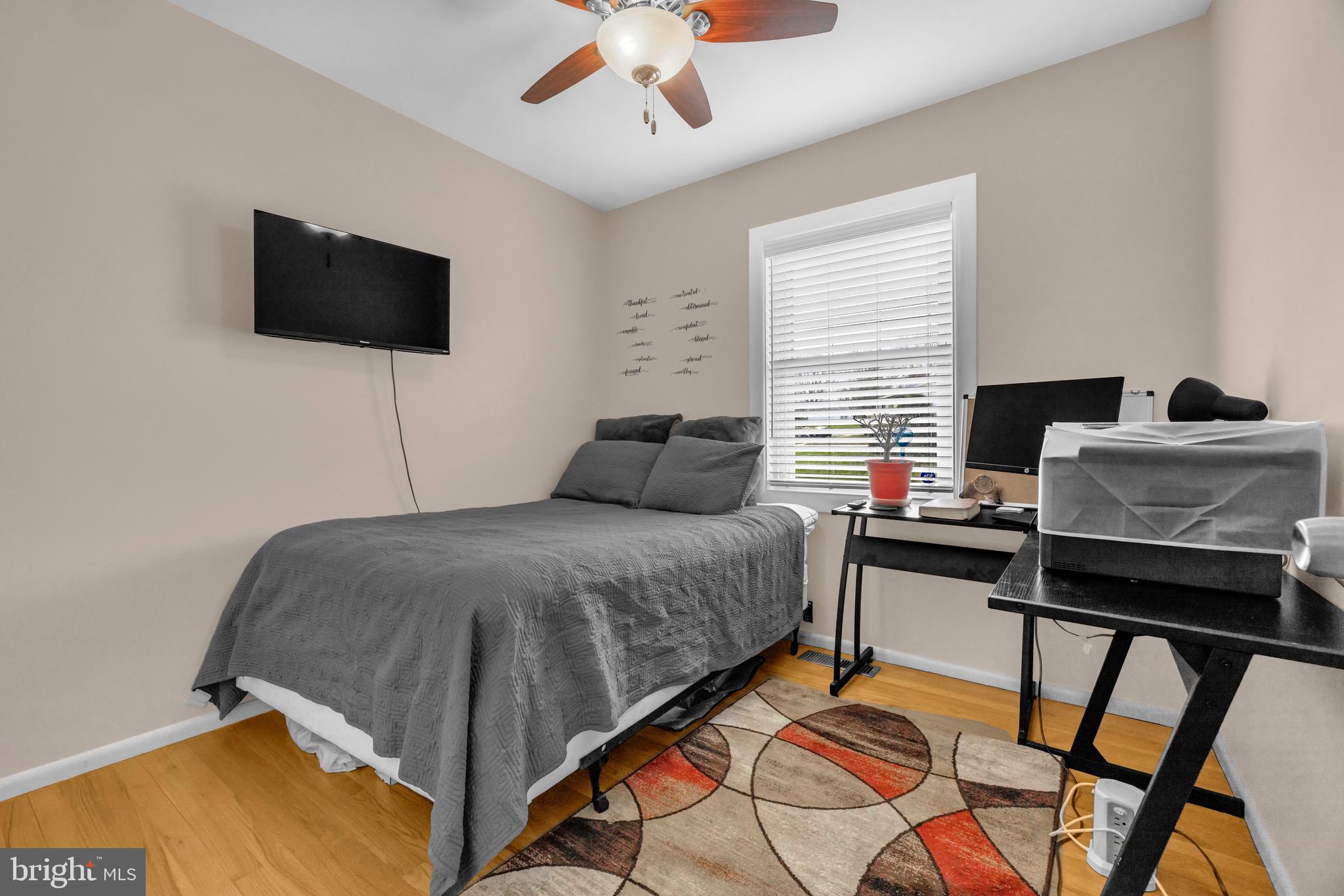 1902 Juniper Road Edgewood, MD 21040 - Photo 19 of 36 a bedroom with a bed and a flat screen tv