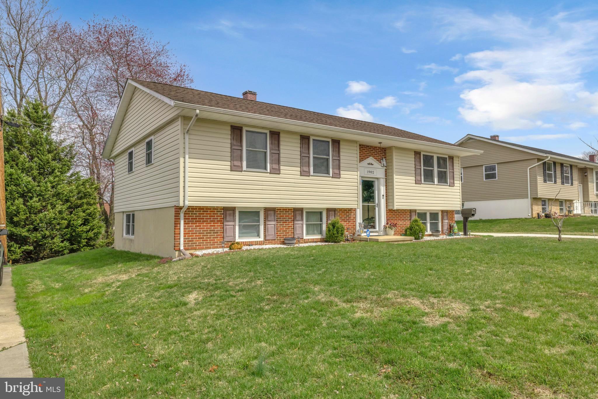 1902 Juniper Road Edgewood, MD 21040 - Photo 2 of 36 a front view of a house with a garden