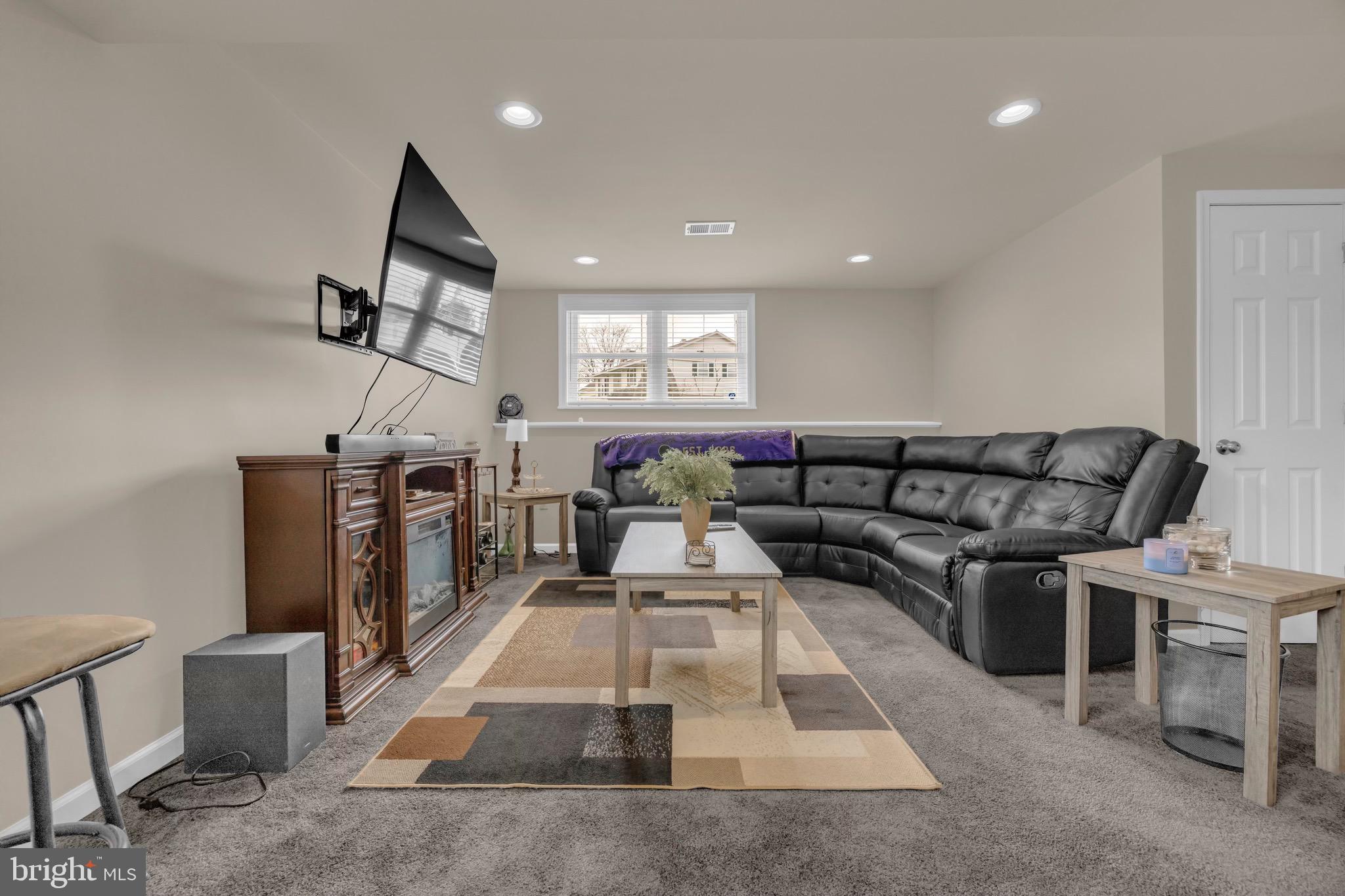 1902 Juniper Road Edgewood, MD 21040 - Photo 26 of 36 a living room with furniture a flat screen tv and a fireplace