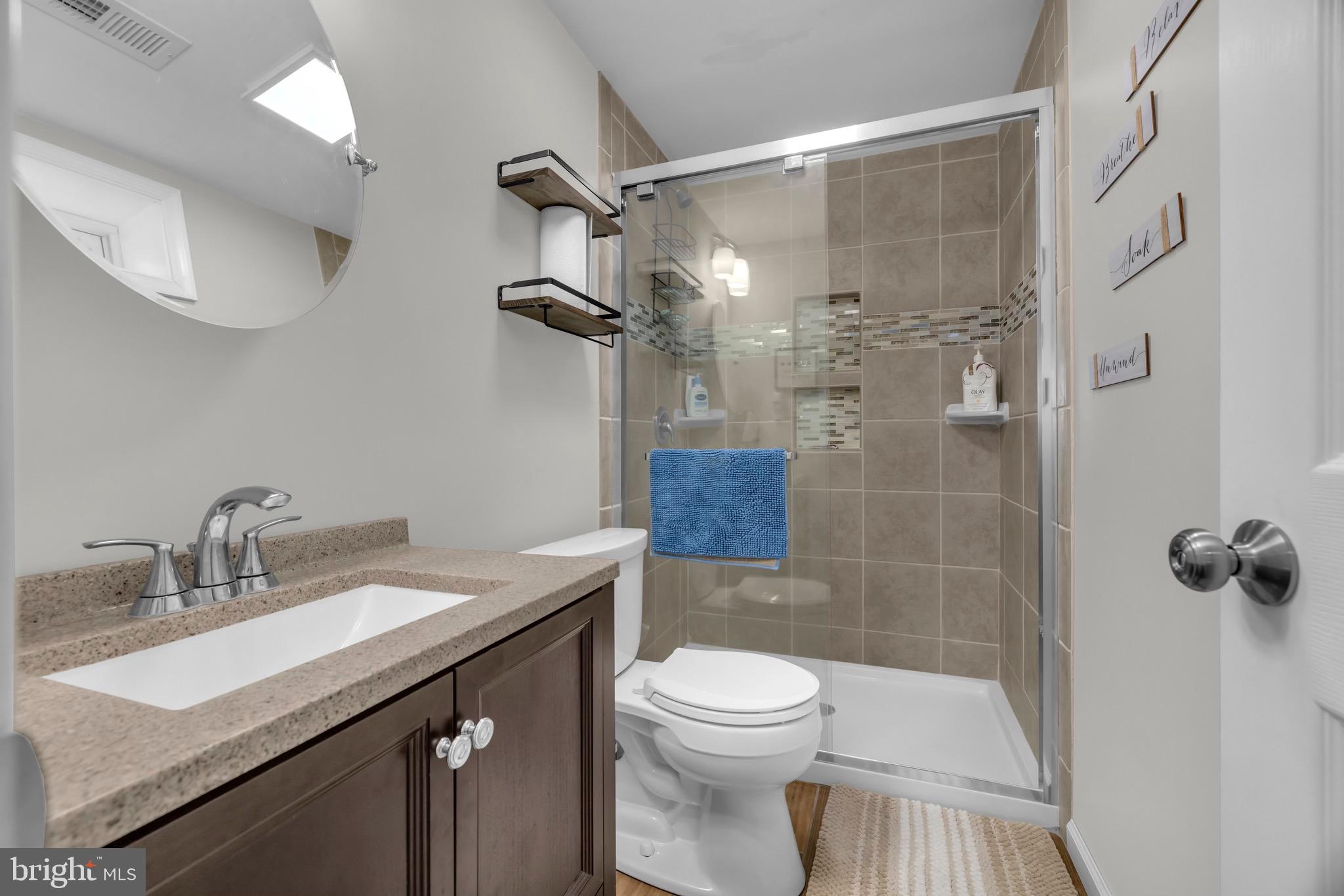1902 Juniper Road Edgewood, MD 21040 - Photo 29 of 36 a bathroom with a sink toilet a mirror and shower