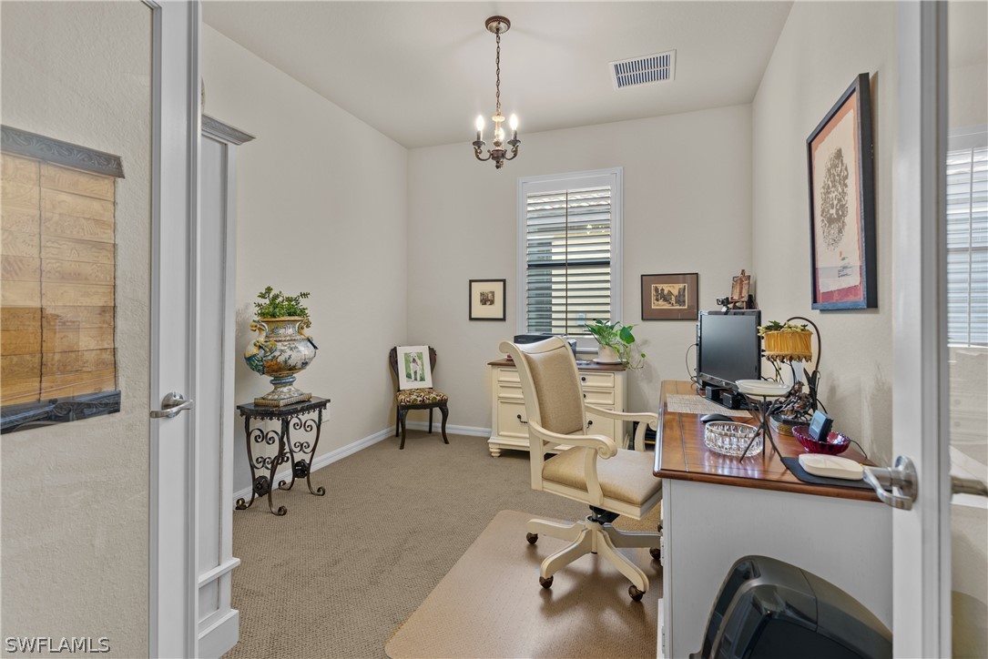 8944 Water Tupelo Road Fort Myers, FL 33912 - Photo 16 of 29 a view of a workspace with furniture and a window