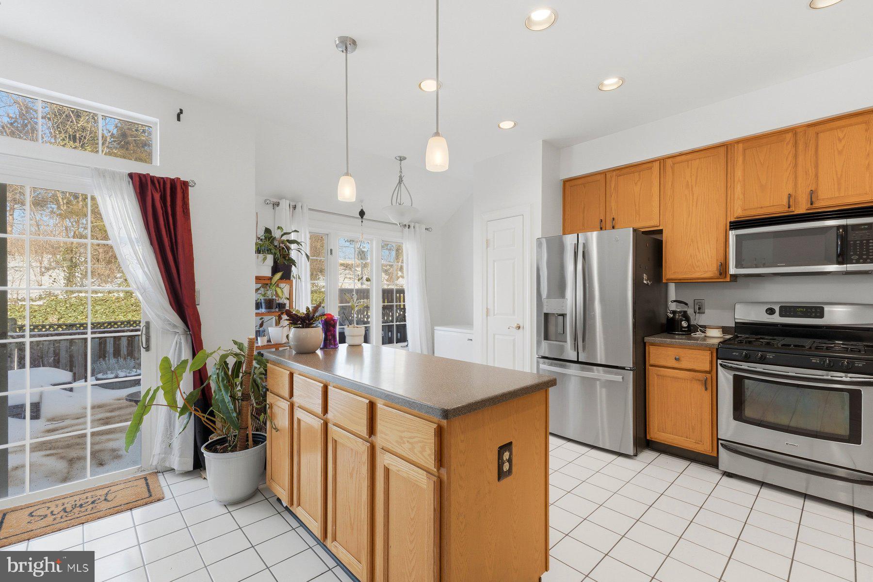 3632 Ransom Place Alexandria, VA 22306 - Photo 7 of 33 a kitchen with stainless steel appliances granite countertop a refrigerator and a sink
