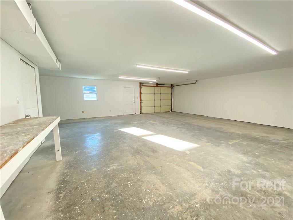 621 Stallings Road, Unit A Matthews, NC 28104 - Photo 4 of 10 an empty room with windows