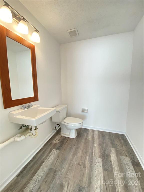621 Stallings Road, Unit A Matthews, NC 28104 - Photo 7 of 10 a bathroom with a sink and a mirror