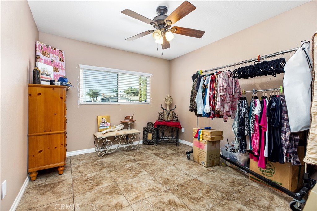 3243 Temescal Avenue Norco, CA 92860 - Photo 12 of 52 a living room with lots of furniture and a chandelier