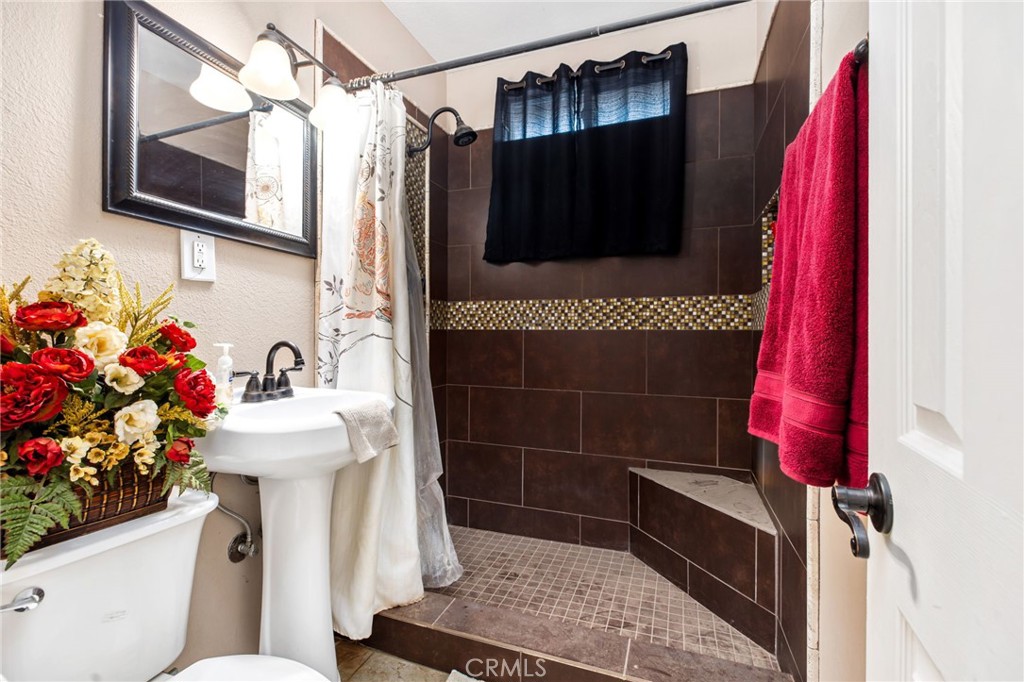 3243 Temescal Avenue Norco, CA 92860 - Photo 15 of 52 a bathroom with a sink toilet and shower