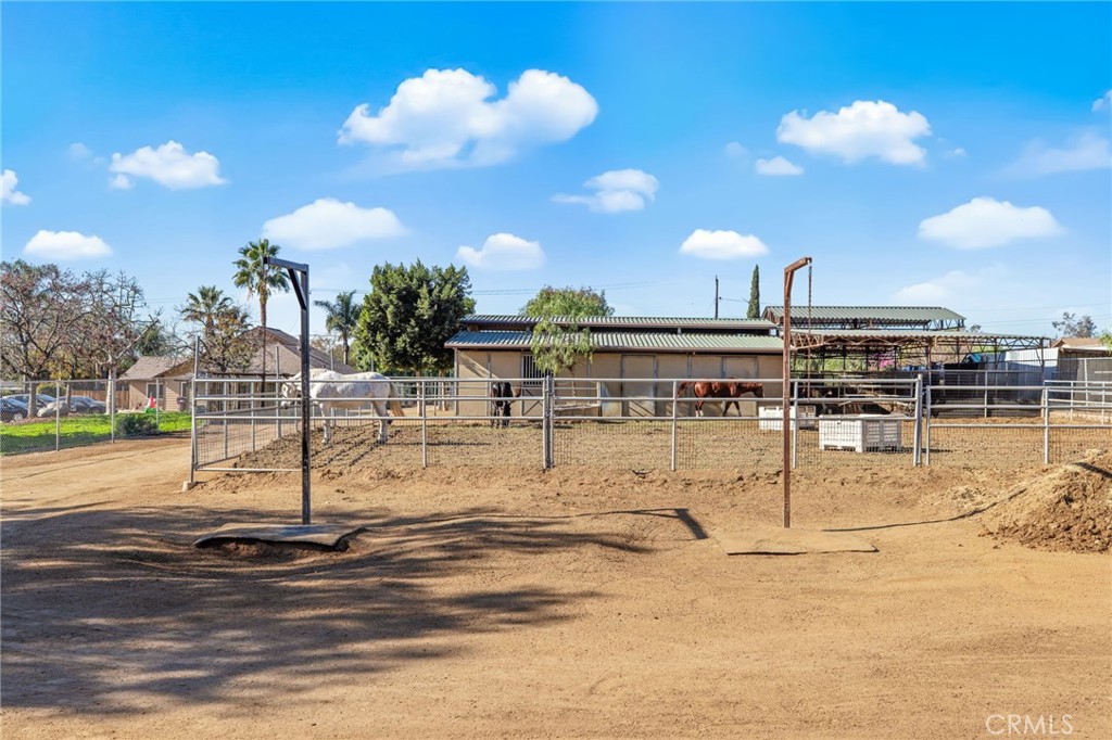 3243 Temescal Avenue Norco, CA 92860 - Photo 22 of 52 a view of a swimming pool with a table and chairs