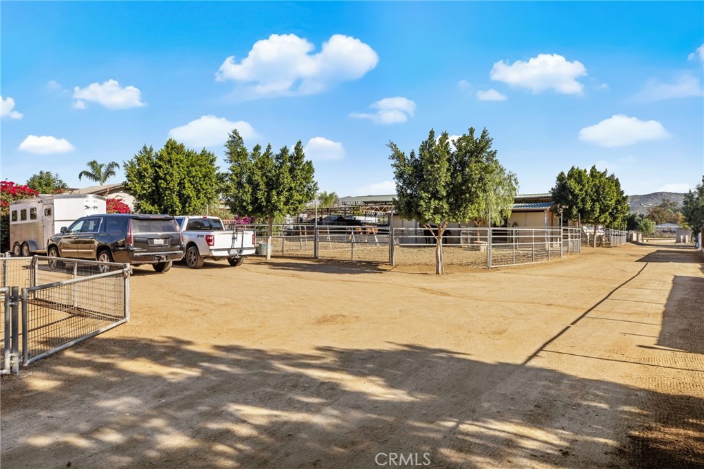 3243 Temescal Avenue Norco, CA 92860 - Photo 41 of 52 a view of a swimming pool with a table and chairs