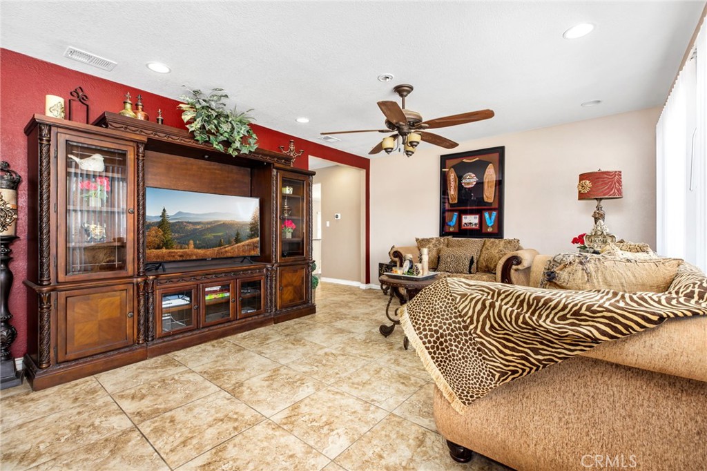 3243 Temescal Avenue Norco, CA 92860 - Photo 5 of 52 a living room with furniture and a flat screen tv