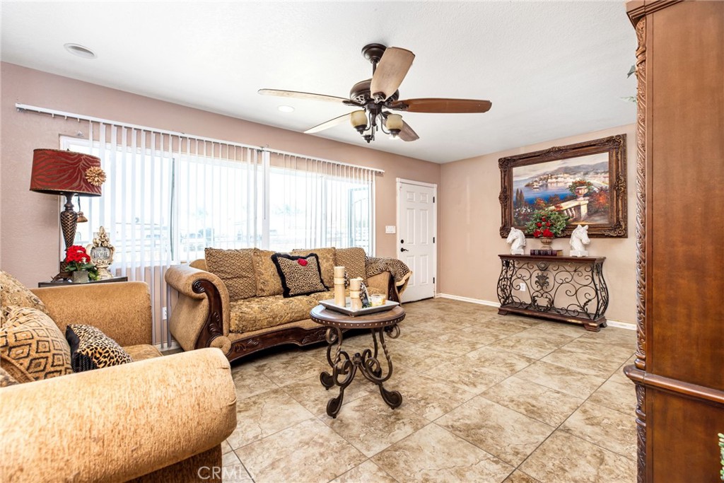 3243 Temescal Avenue Norco, CA 92860 - Photo 7 of 52 a living room with furniture and a chandelier