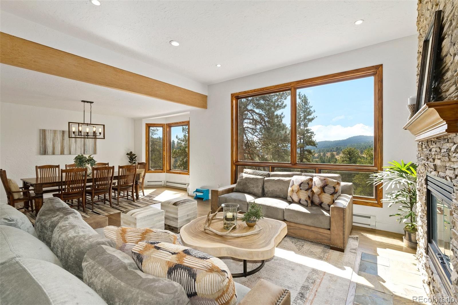 24140 Highway 40 Golden, CO 80401 - Photo 13 of 40 a living room with furniture and a large window