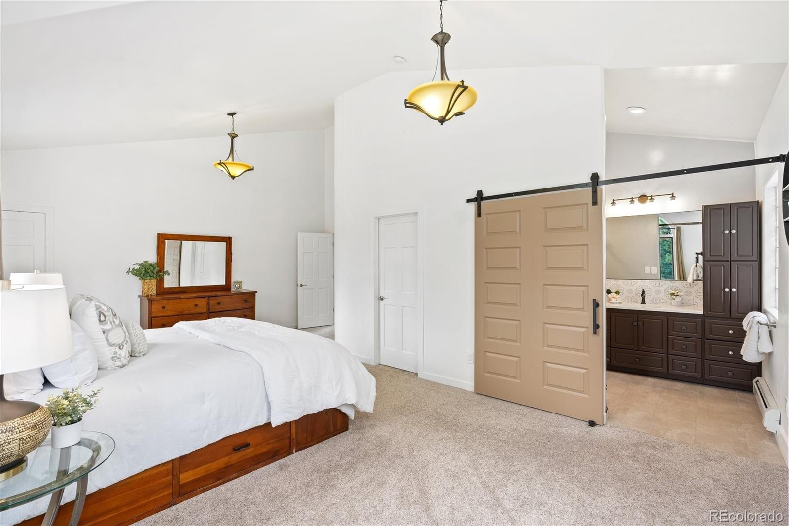 24140 Highway 40 Golden, CO 80401 - Photo 19 of 40 a bedroom with a bed and ceiling fan