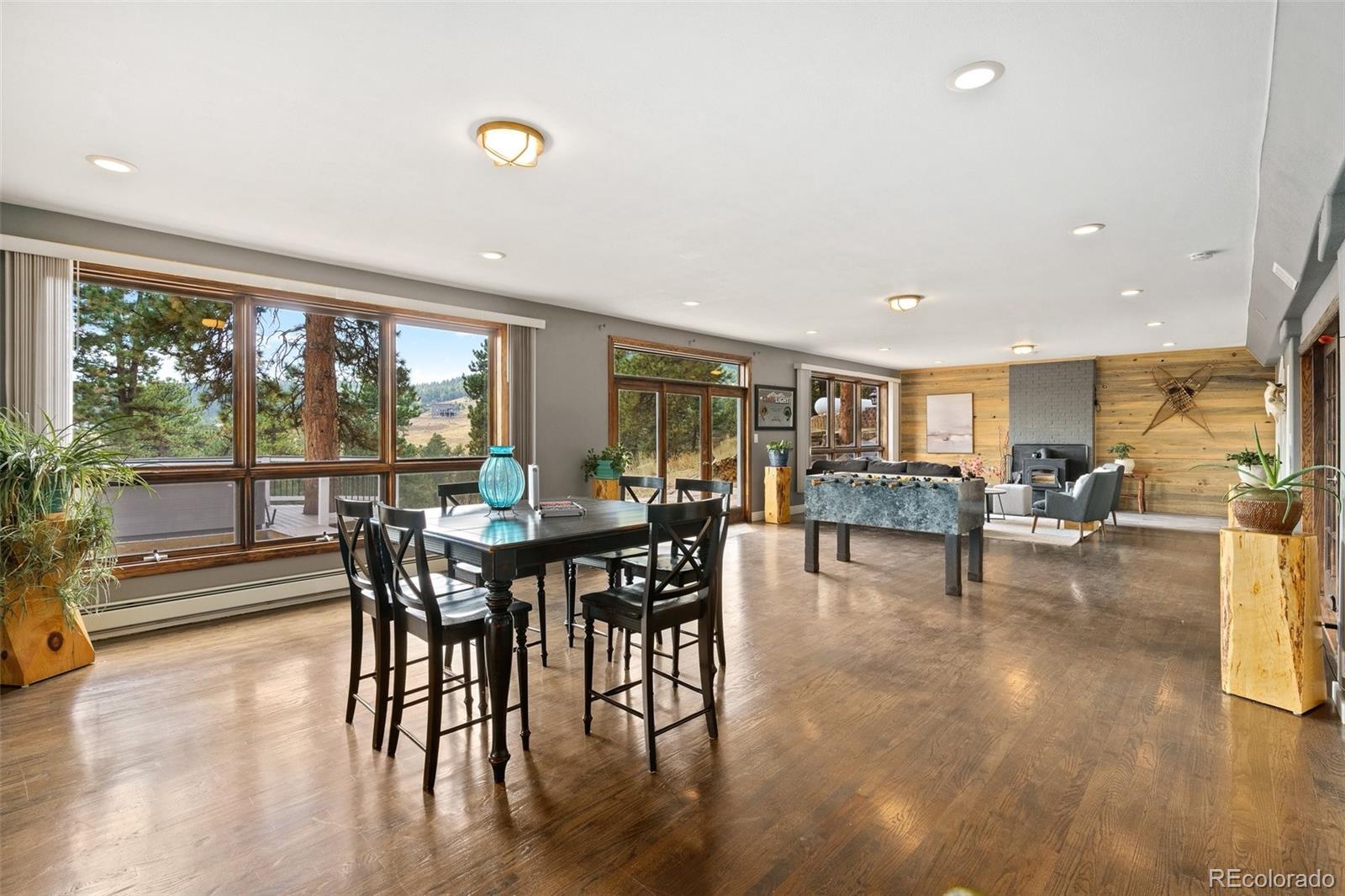 24140 Highway 40 Golden, CO 80401 - Photo 26 of 40 a view of a dining room with furniture window and wooden floor