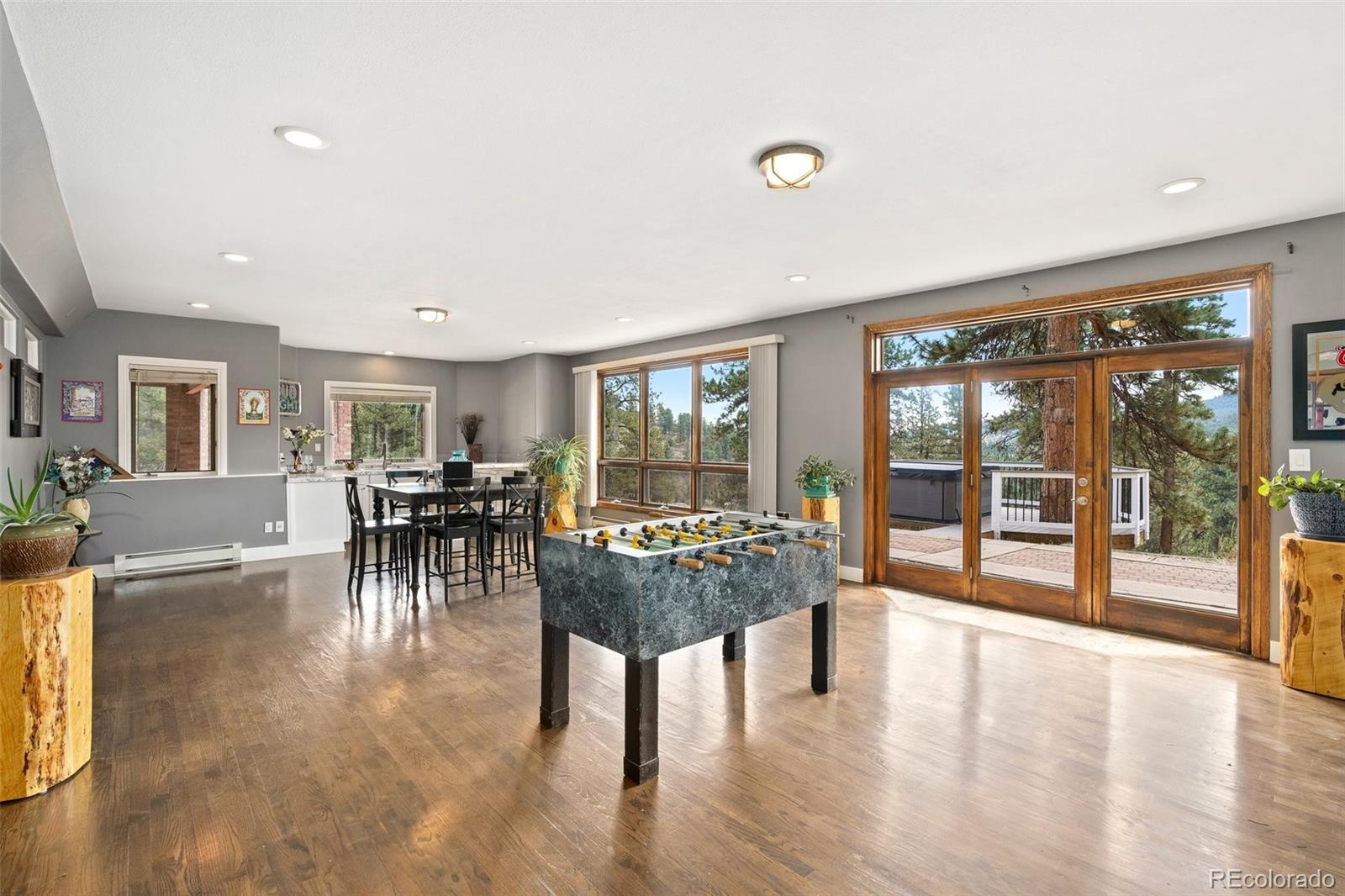 24140 Highway 40 Golden, CO 80401 - Photo 27 of 40 a living room with furniture a table and a large window
