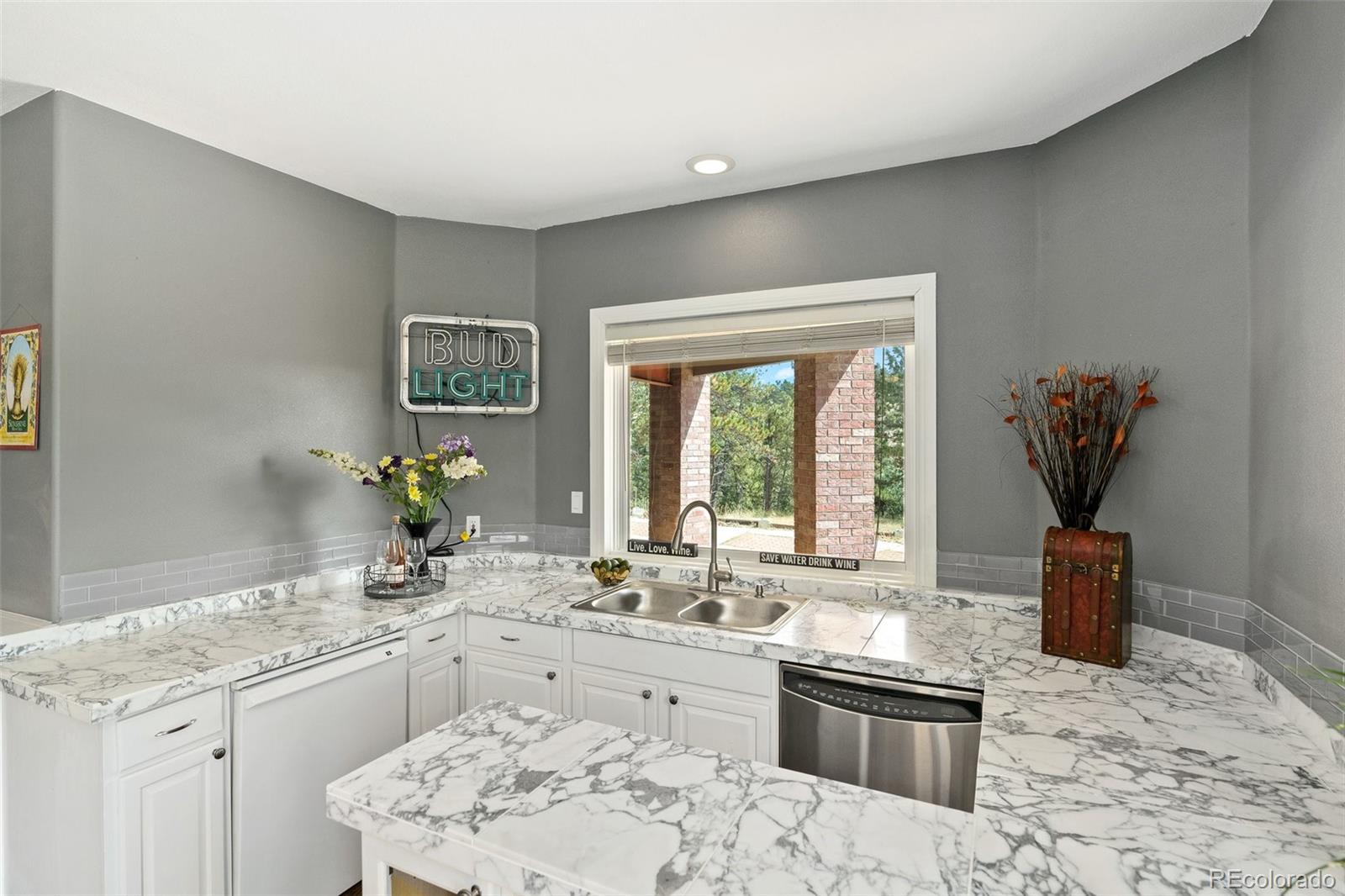 24140 Highway 40 Golden, CO 80401 - Photo 28 of 40 a kitchen with stainless steel appliances granite countertop a sink stove and refrigerator
