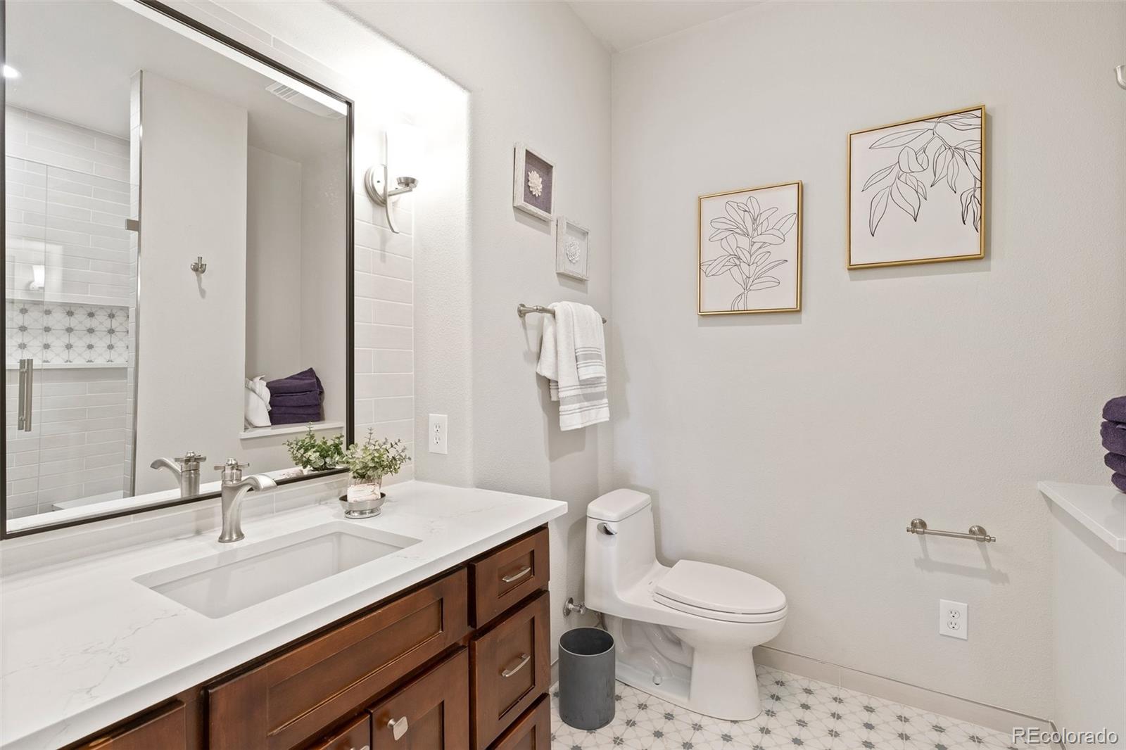 24140 Highway 40 Golden, CO 80401 - Photo 30 of 40 a bathroom with a toilet sink and mirror