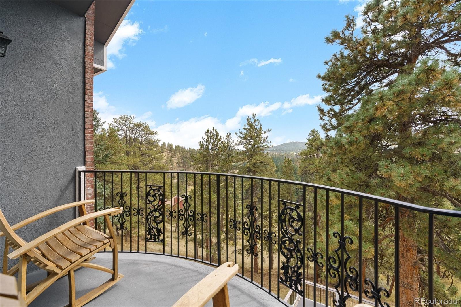 24140 Highway 40 Golden, CO 80401 - Photo 32 of 40 a view of a balcony with wooden floor and fence