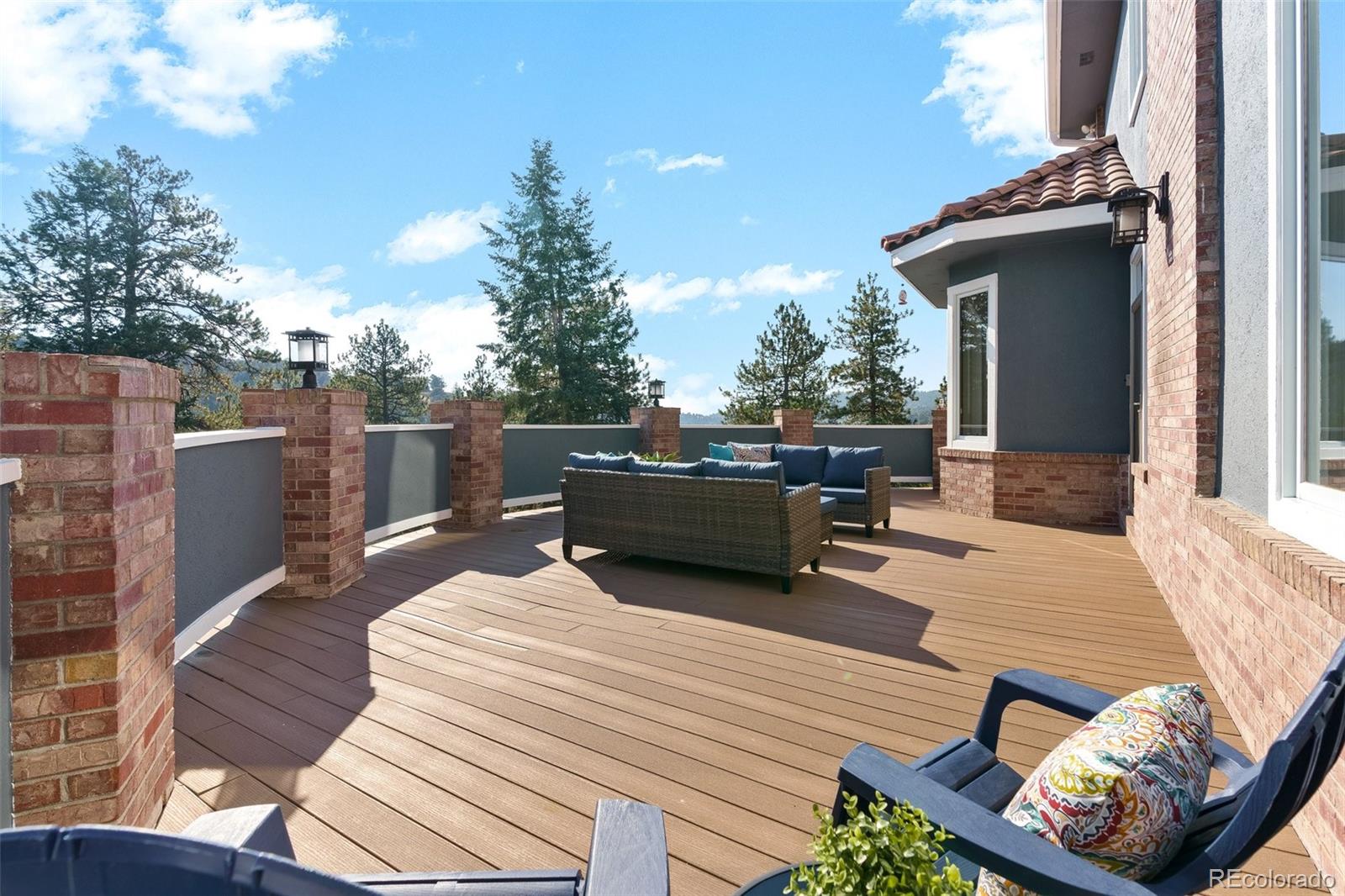 24140 Highway 40 Golden, CO 80401 - Photo 34 of 40 a view of a roof deck with couches and wooden floor