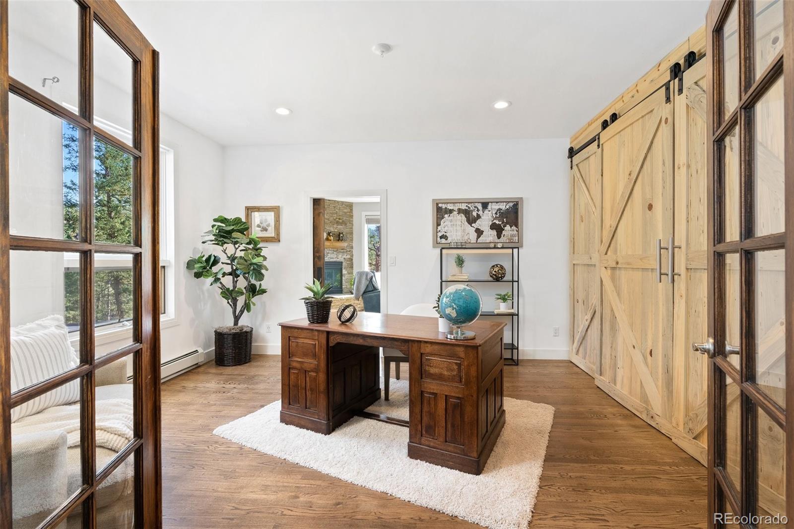 24140 Highway 40 Golden, CO 80401 - Photo 5 of 40 a dining room with furniture and a potted plant