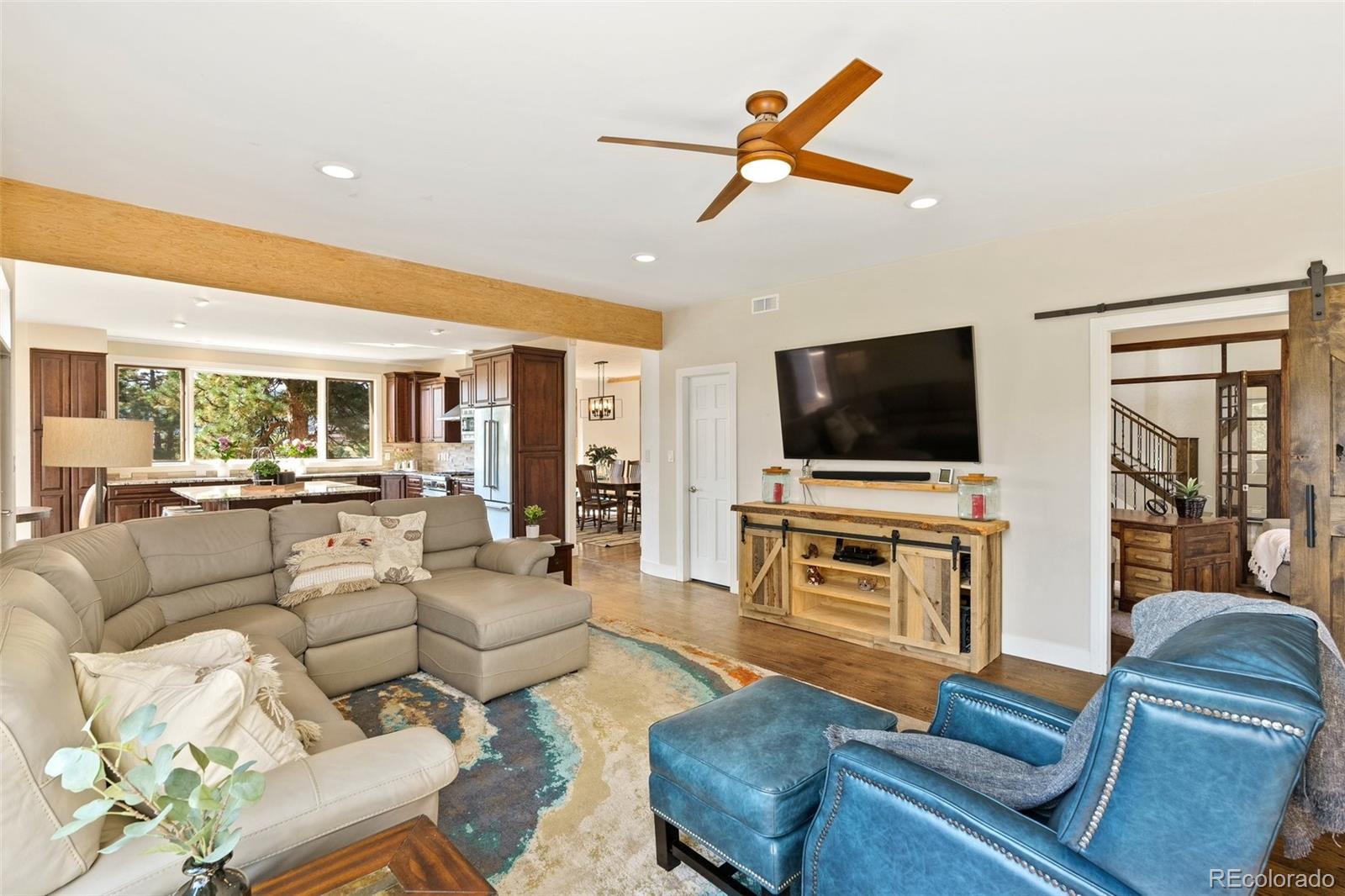 24140 Highway 40 Golden, CO 80401 - Photo 7 of 40 a living room with furniture and a flat screen tv