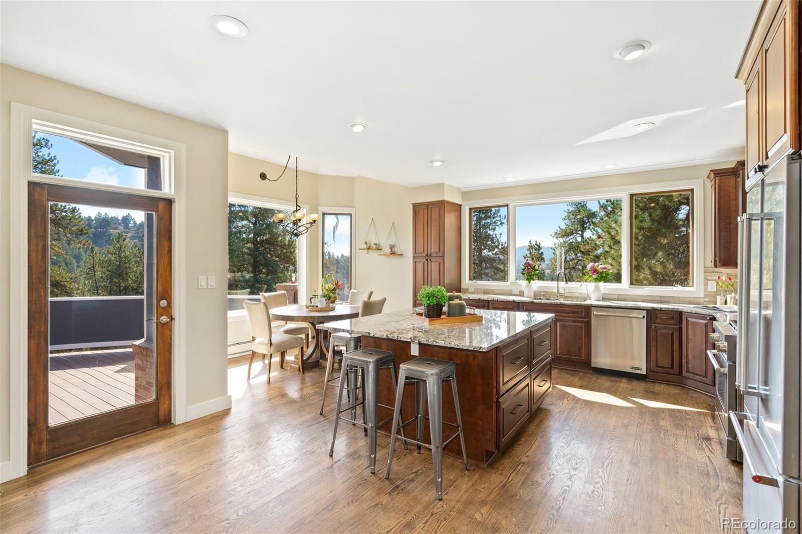 24140 Highway 40 Golden, CO 80401 - Photo 8 of 40 a large kitchen with lots of counter top space and stainless steel appliances