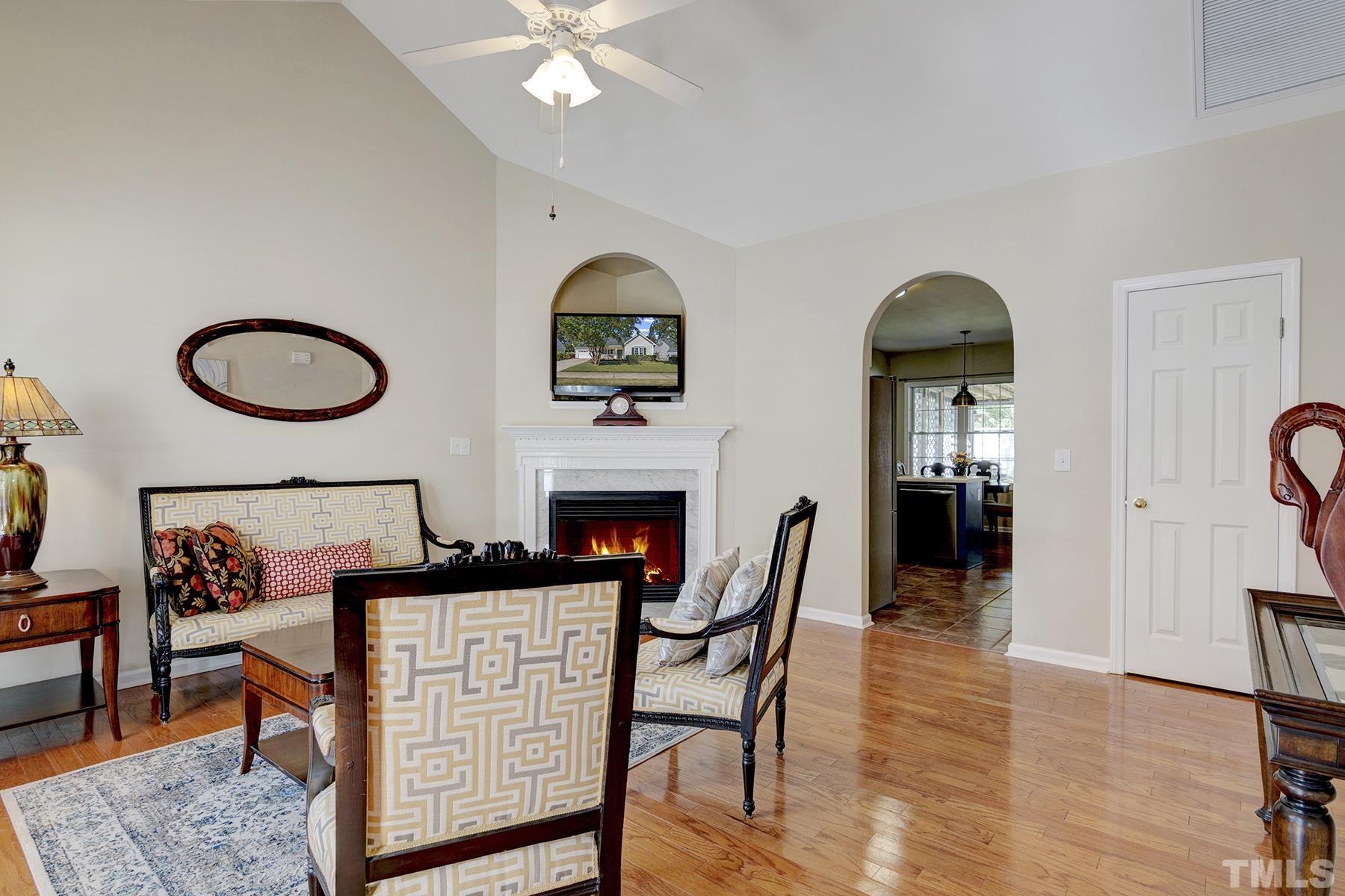 5413 Neuse Forest Road Raleigh, NC 27616 - Photo 7 of 27 a view of a livingroom with furniture and a fireplace
