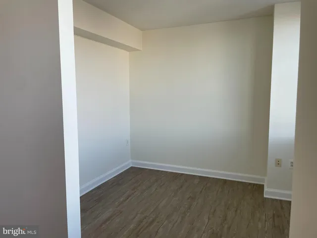 a view of a hallway with a window