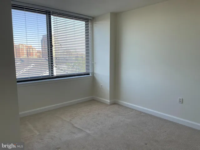 a view of an empty room and closet
