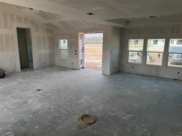 a view of a livingroom with an empty space and window
