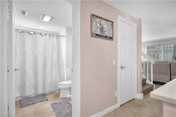 a bathroom with a shower toilet and sink