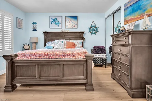 a bedroom with a bed and a dresser