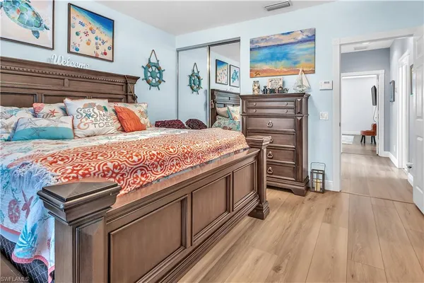 a bed room with a bed and a television