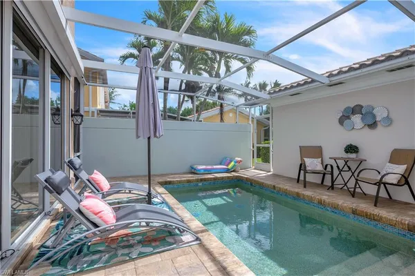 a outdoor space with lots of white furniture