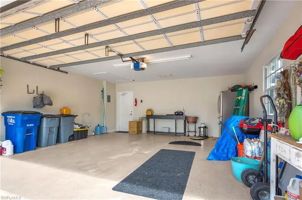 a bed room with a bed and a chandelier