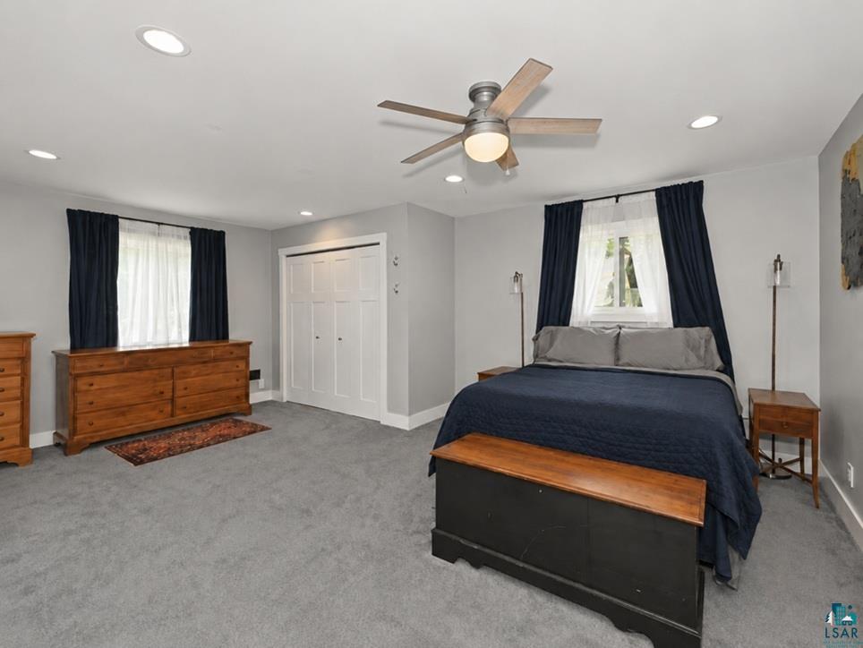 88440 Huron Street Cornucopia, WI 54827 - Photo 15 of 44 Carpeted room with recessed lighting and a ceiling fan.